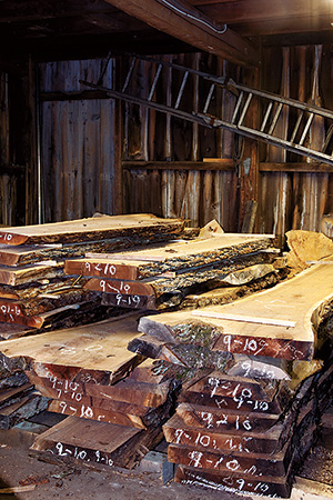 Stacks of pre-cut and marked live-edge lumber