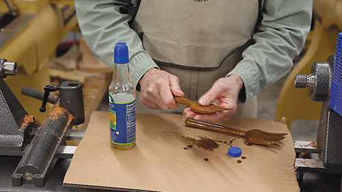 Rubbing walnut oil finish on a salad fork