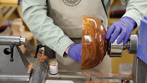 Sanding down inside of bowl with oil-based finish