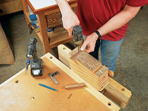 Screwing feet in place on knife block