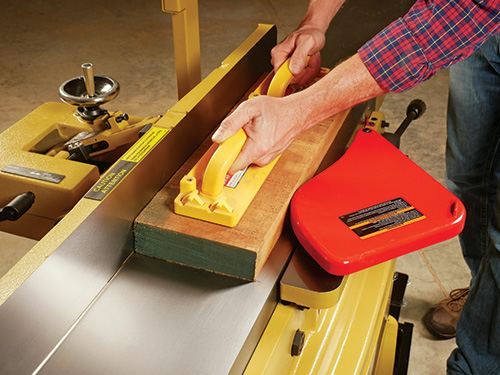 Running board across jointer cutterheads