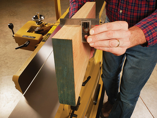 Checking squareness of board after being cut on jointer