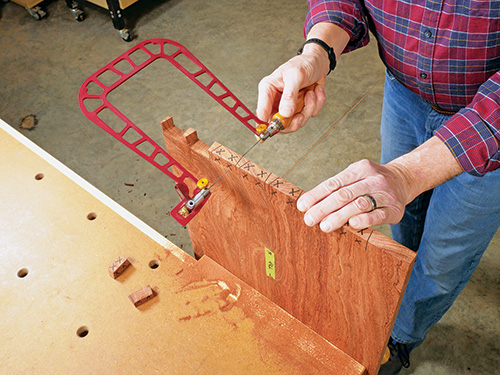 Forming dovetail pins using a fret saw