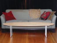 Elliptical wood and steel coffee table