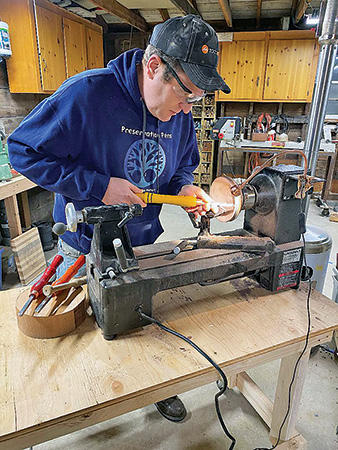 Veteran turning bowl on a lathe